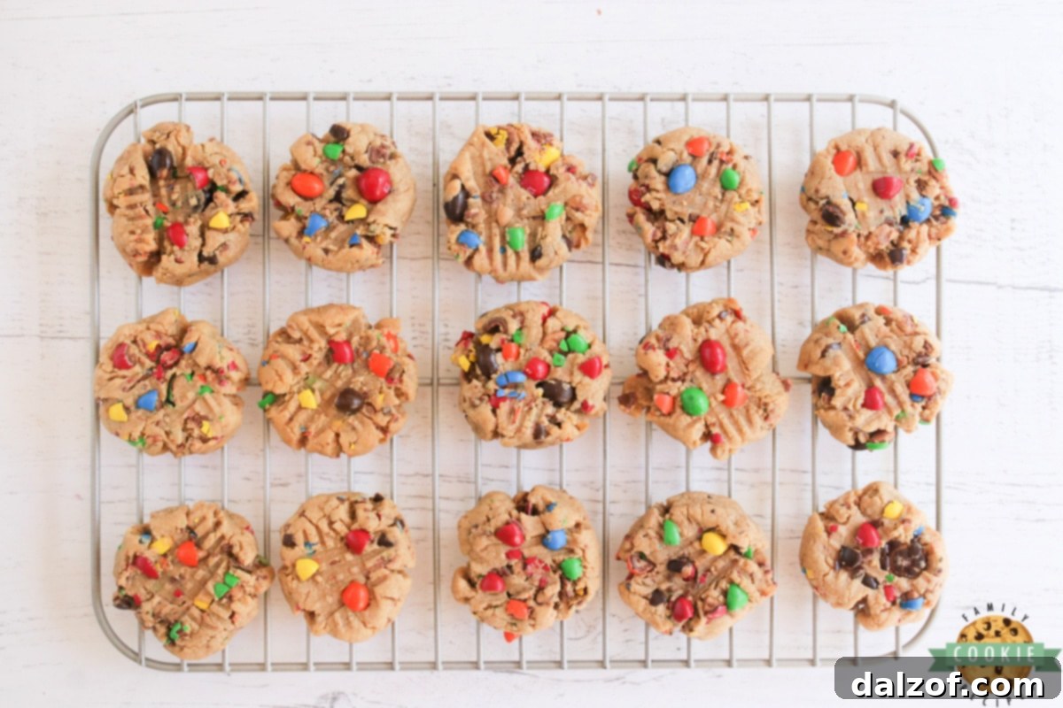 Peanut Butter Cookies with Peanut Butter M&Ms on a wire rack. 