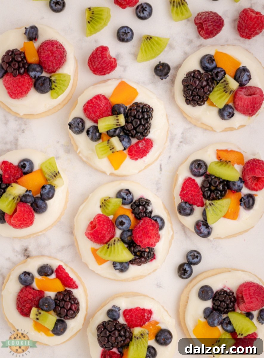 Close-up of a fruit pizza cookie, showcasing its fluffy cookie base and fresh berry toppings