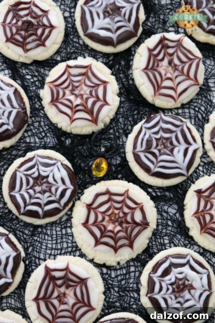Festive Halloween Cobweb Cookies arranged on a serving plate