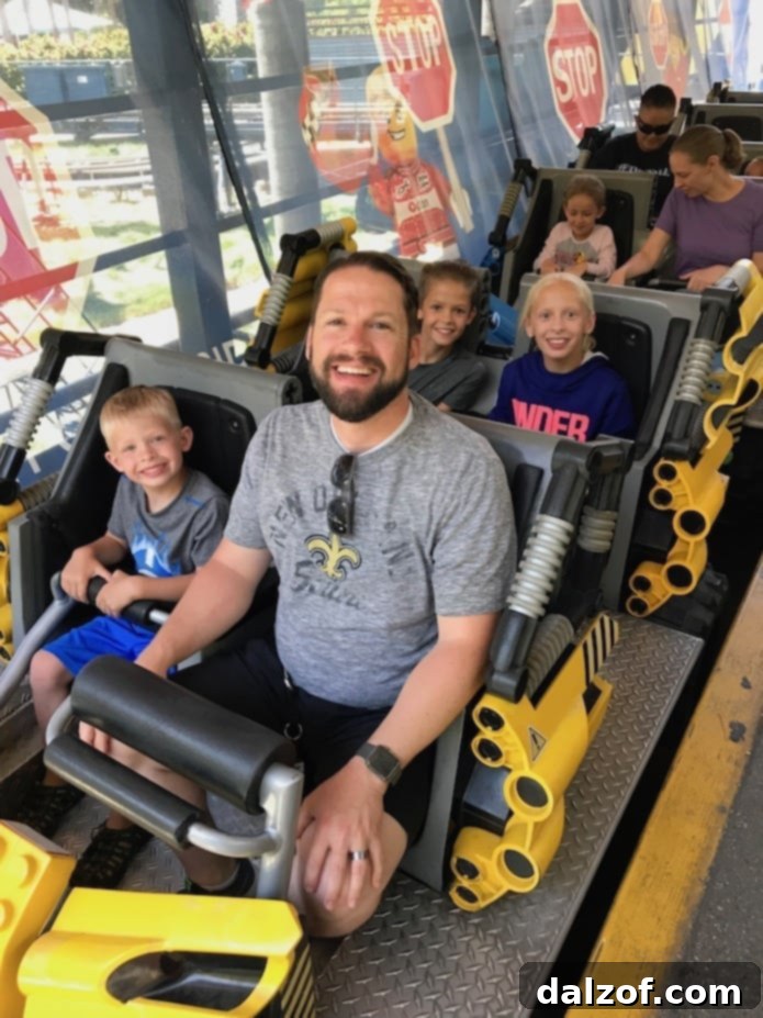 Family enjoying a fun theme park ride, creating lasting memories