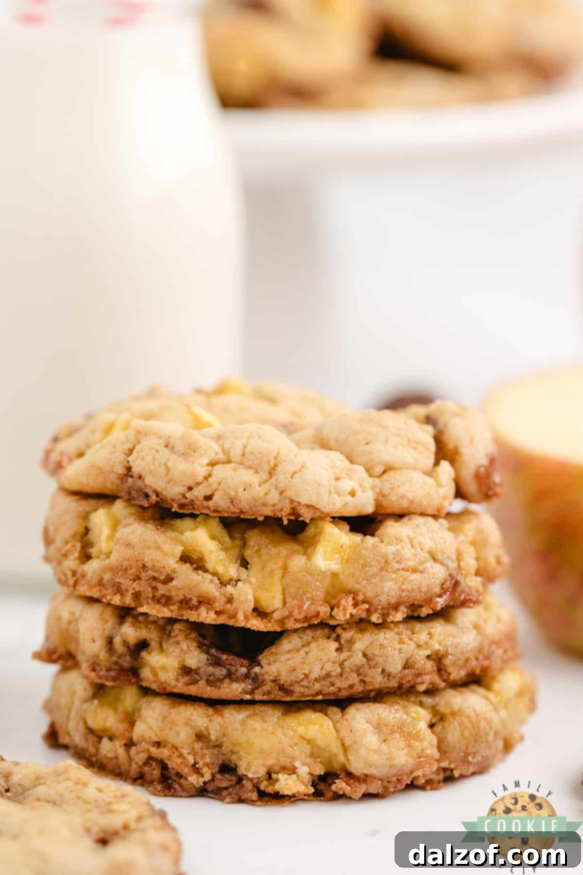 A tall stack of Caramel Apple Cake Mix Cookies, showing their soft centers and delicious mix-ins.