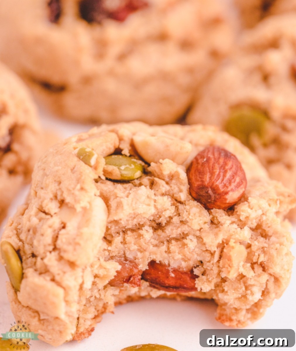bite of a peanut butter cookie made with trail mix. 