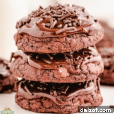 stacked brownie cookies with chocolate frosting and sprinkles