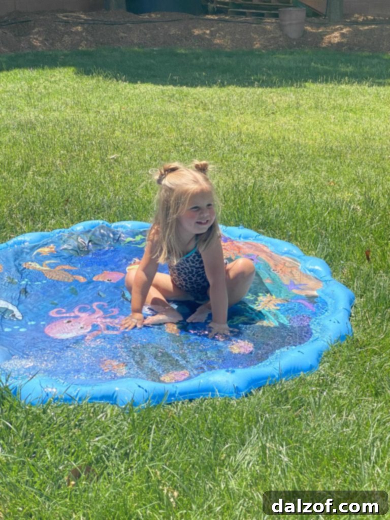 Rich Honey Maple Chocolate Chip Cookies 13 A young child happily playing in water outdoors, enjoying a cool summer activity.