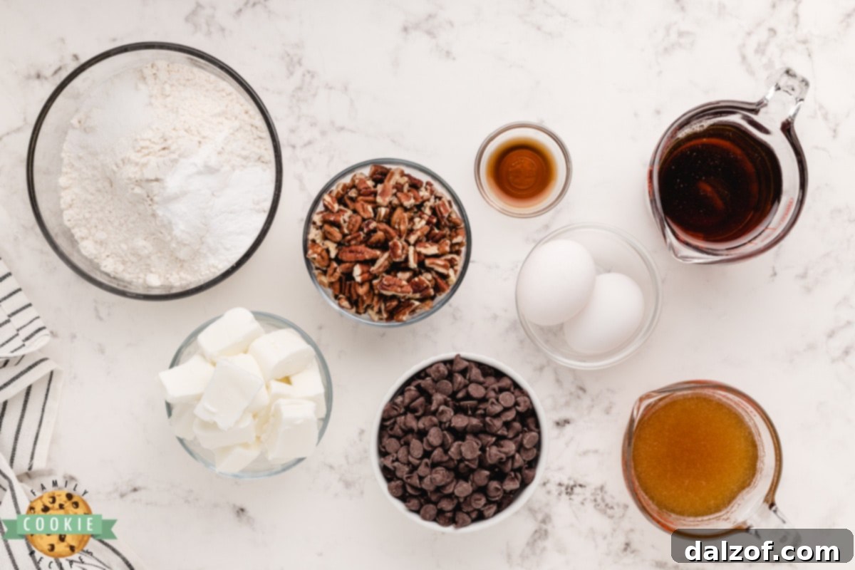 Rich Honey Maple Chocolate Chip Cookies 4 A beautiful flat lay photograph showing all the ingredients meticulously laid out for Honey Maple Chocolate Chip Cookies, including shortening, honey, maple syrup, eggs, vanilla, flour, baking soda, salt, chocolate chips, and pecans.