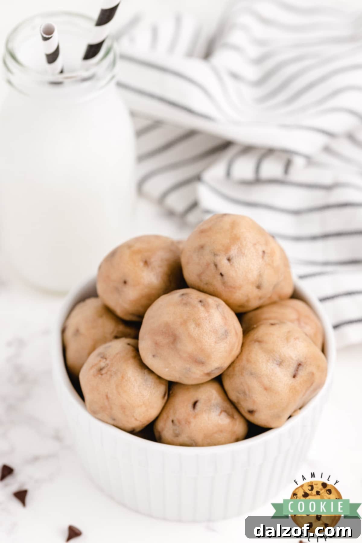 Small, perfectly round balls of edible chocolate chip cookie dough.