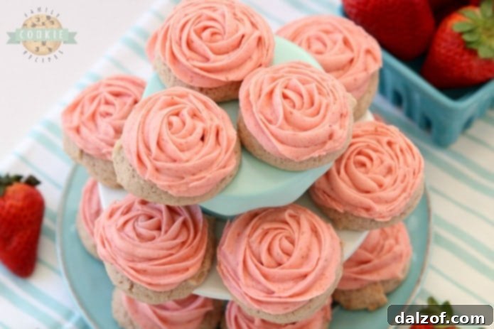 Frosted Strawberry Cookies adorned with a simple pink rose design.
