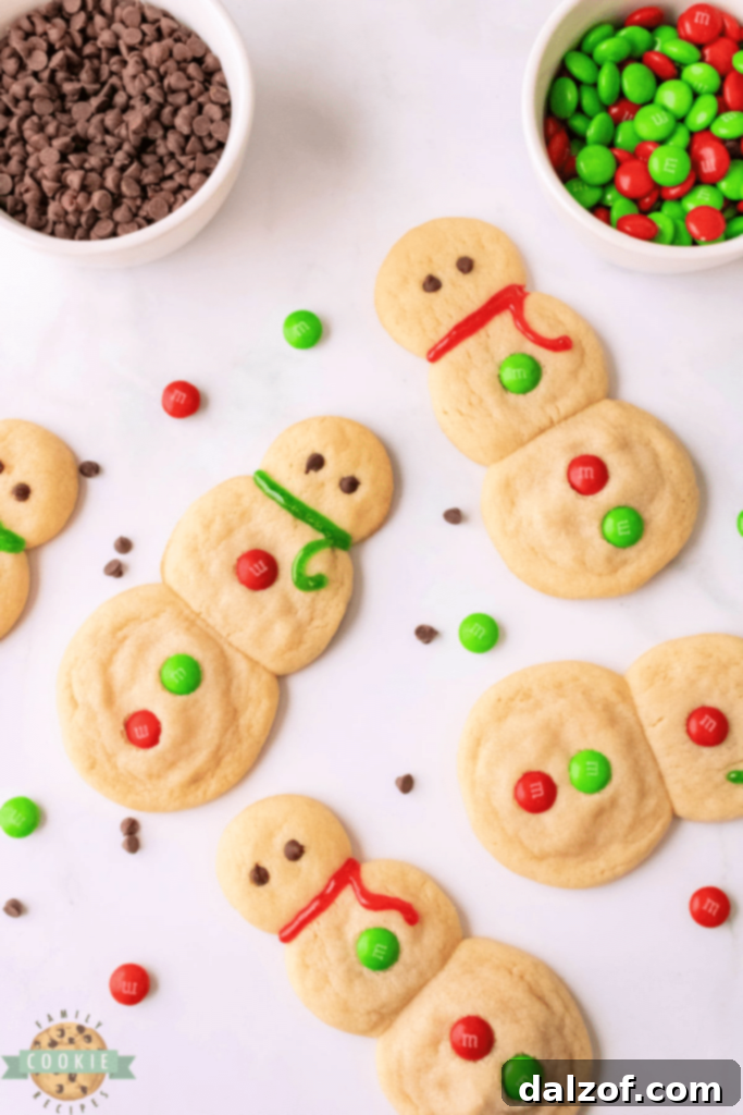 Cute snowman sugar cookies without frosting or intricate decorations.