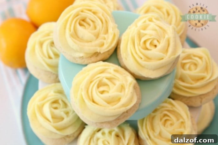 Frosted Lemon Sugar Cookies with a delicate rosette piping.