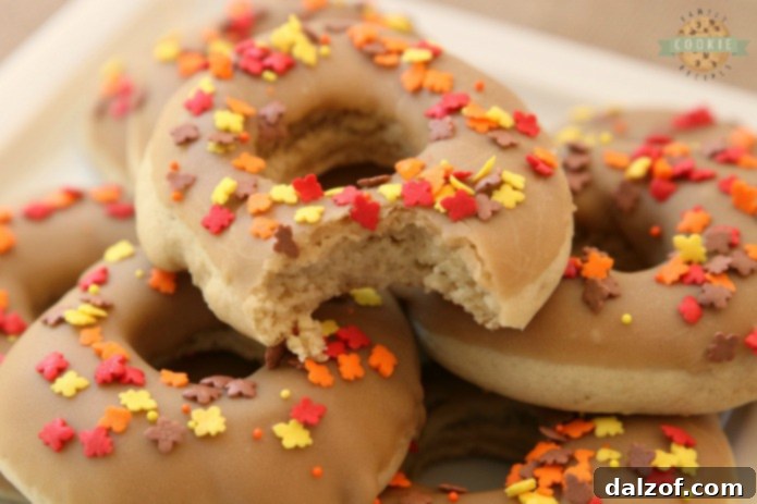 Maple Donut Cookies shaped like donuts with a maple glaze.