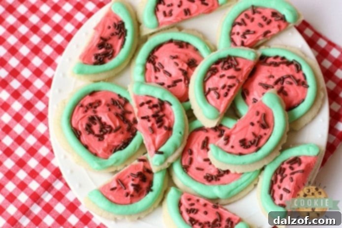 Watermelon Sugar Cookies decorated with green, red, and chocolate sprinkles.