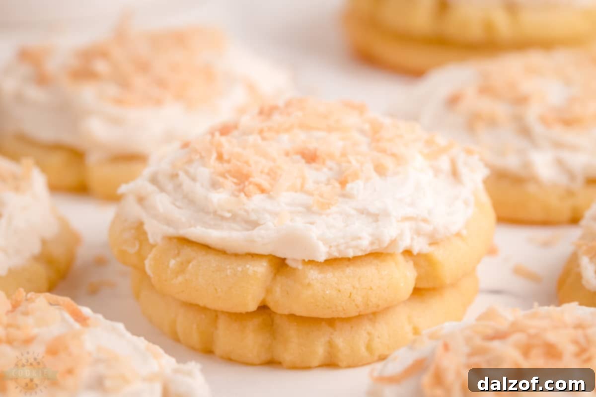 Frosted Coconut Sugar Cookies with toasted coconut flakes.