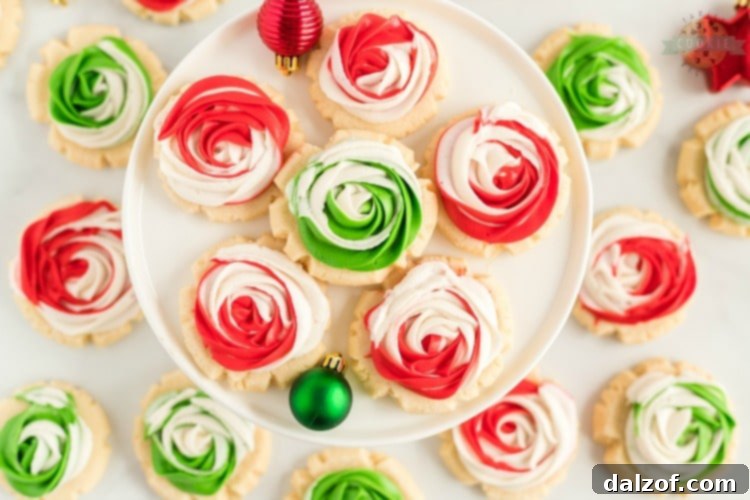 Frosted Rose Sugar Cookies decorated with a beautiful swirled rosette.