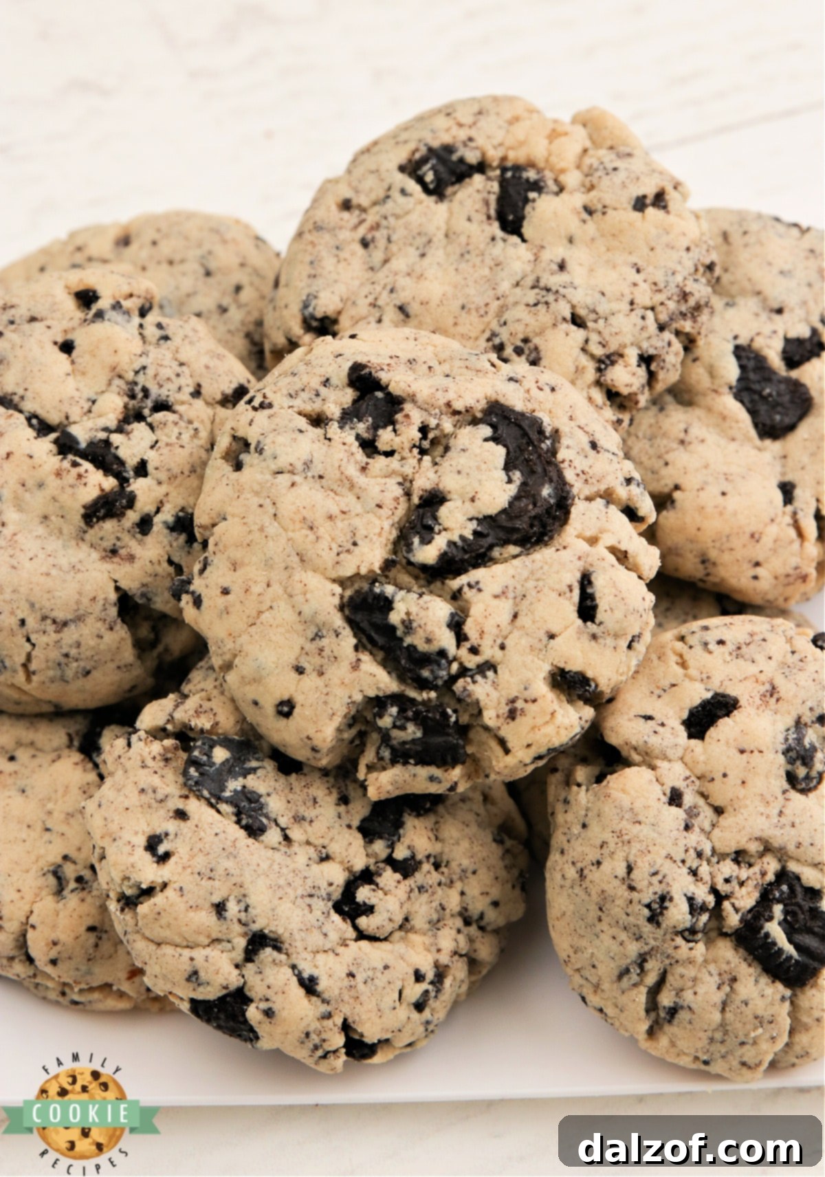 Freshly baked peanut butter cookies with visible Oreo chunks.