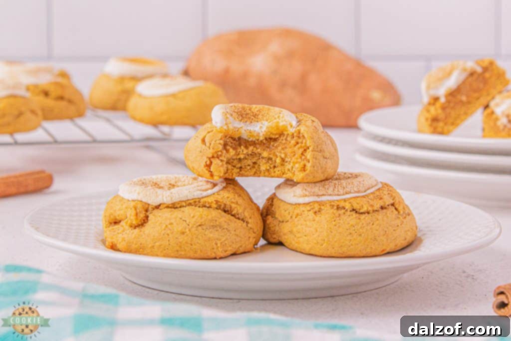 A stack of golden-brown sweet potato cookies, displaying their inviting texture.