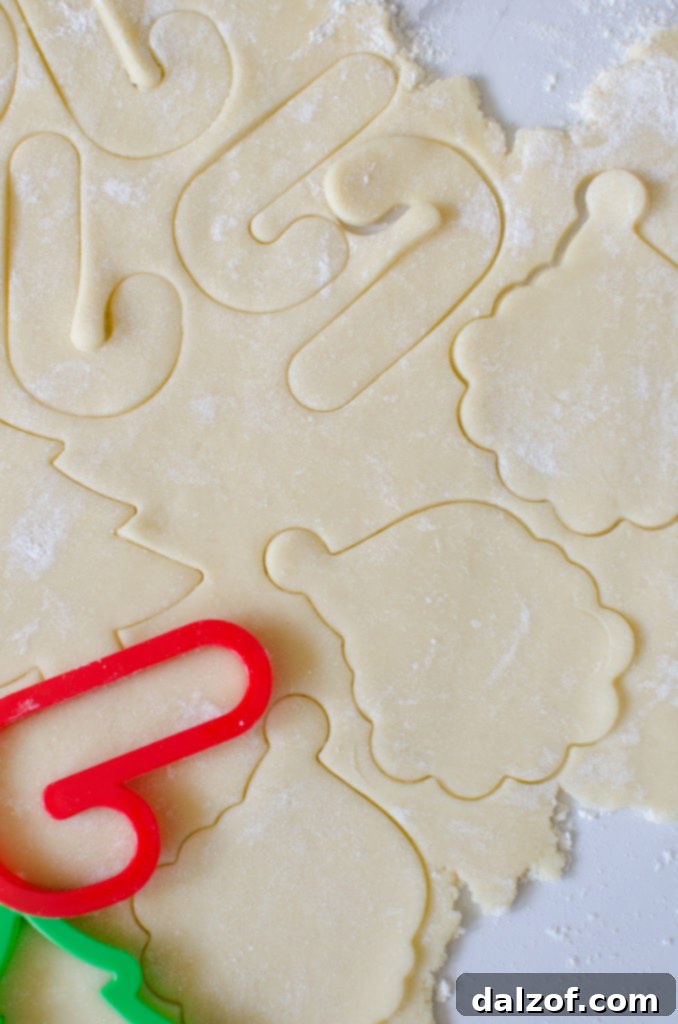 Delicious Christmas Sugar Cookies adorned with a rich, creamy buttercream frosting, perfect for festive celebrations and holiday gifting.