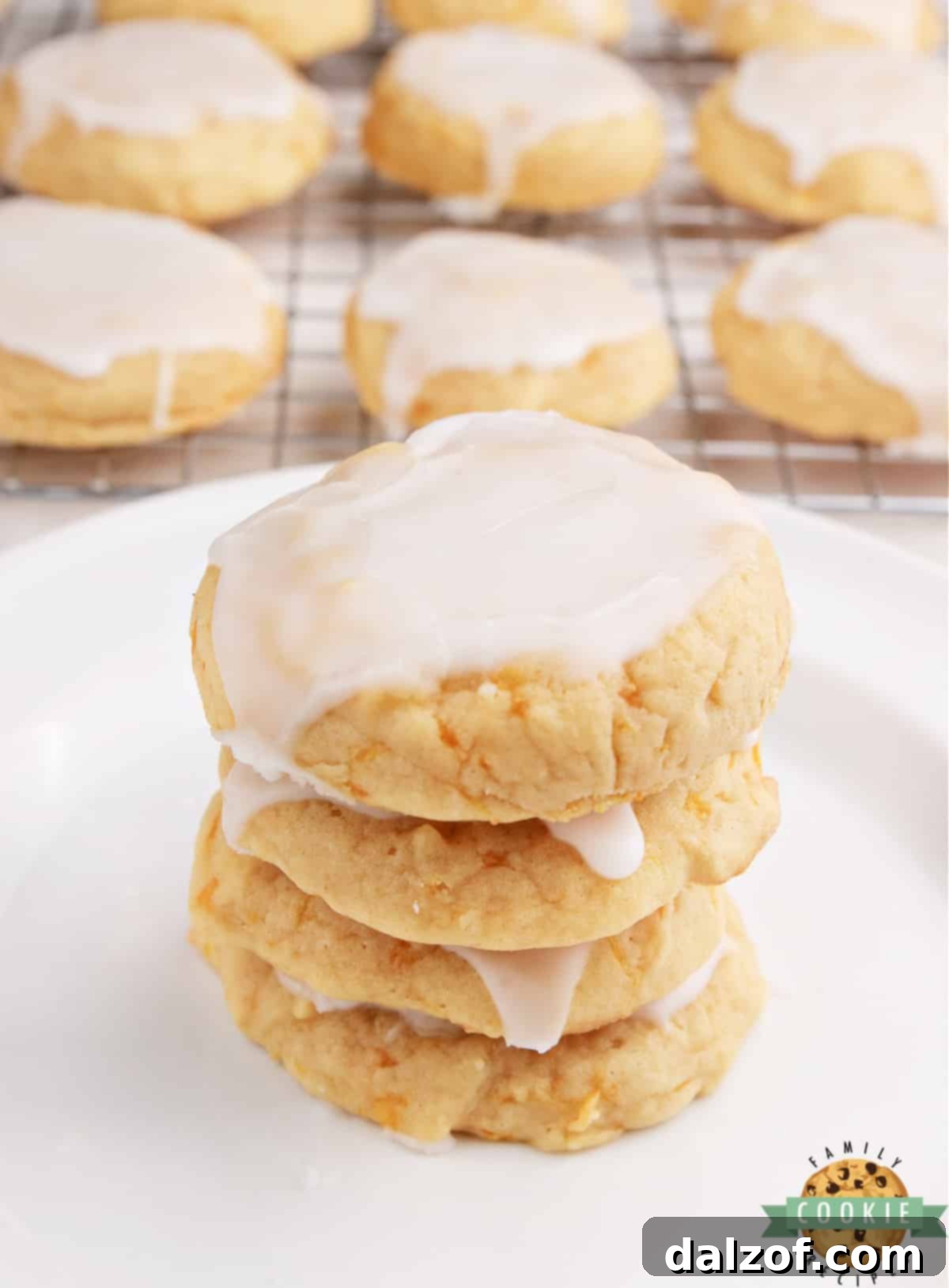Soft and moist mandarin orange cookies, highlighting their delicate texture and flecks of orange within.