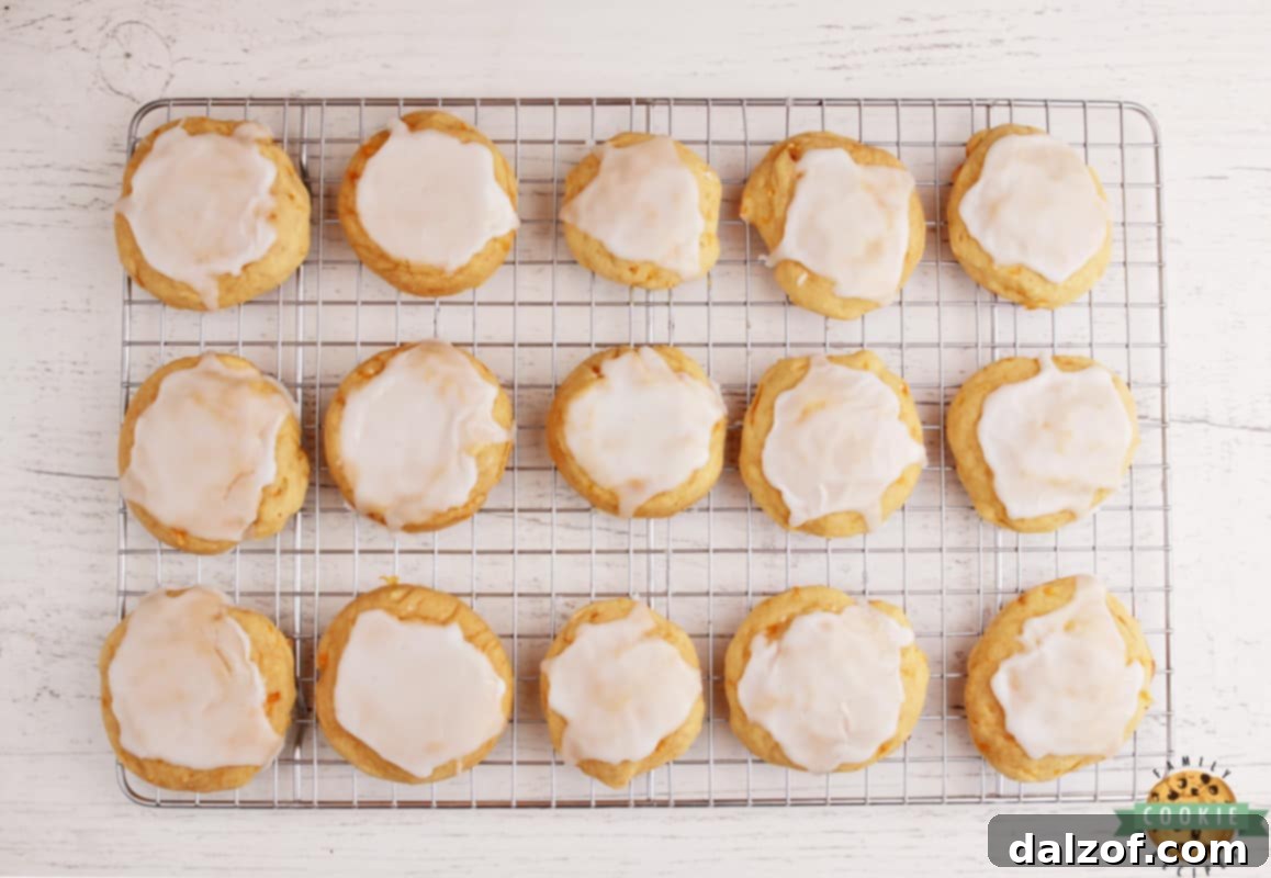A batch of Glazed Mandarin Orange Cookies ready to be enjoyed, showcasing the simple orange glaze.