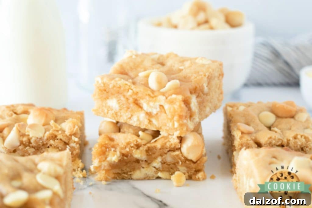 Soft and chewy cookie bars with white chocolate chips and macadamia nuts
