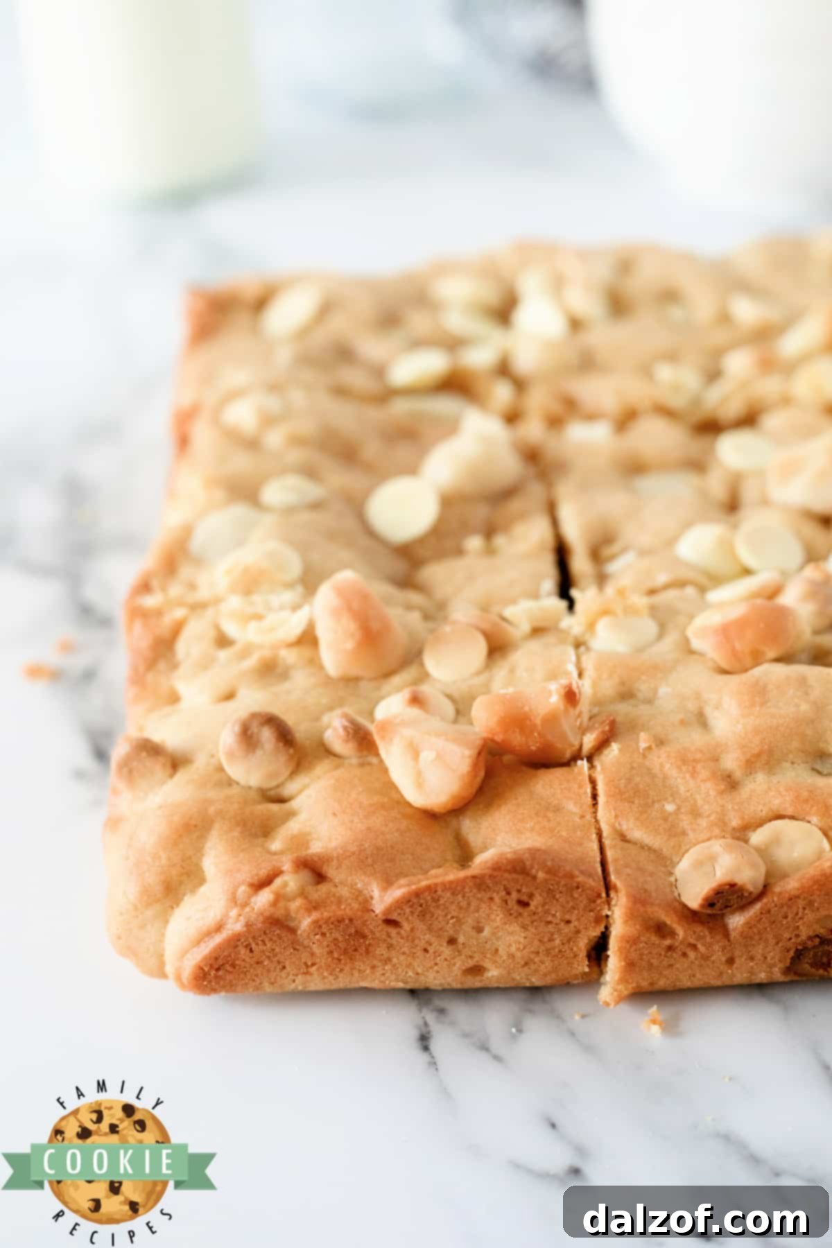 Cookie bars made with white chocolate chips and macadamia nuts