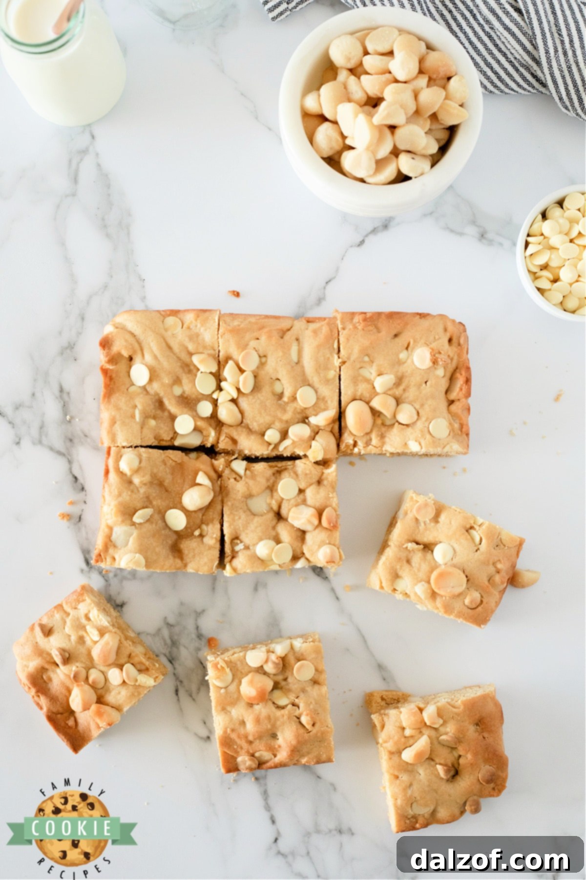 White Chocolate Macadamia Cookie Bars are thick, soft and absolutely delicious. Simple cookie bar recipe packed with white chocolate chips and macadamia nuts. 