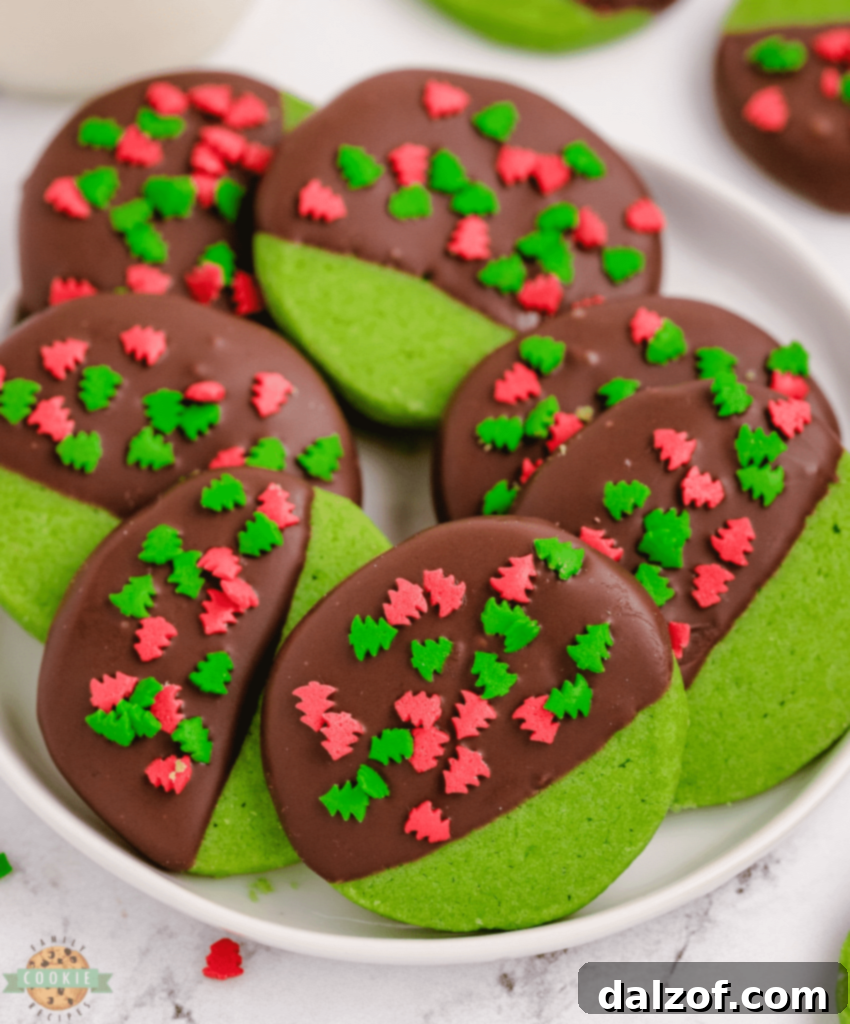 Festive Mint Christmas Cookies adorned with colorful holiday sprinkles, offering a mint-chocolate delight.