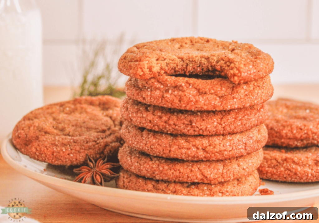 Crisp Gingersnap Cookies, featuring their signature cracked tops and warm spicy flavor.
