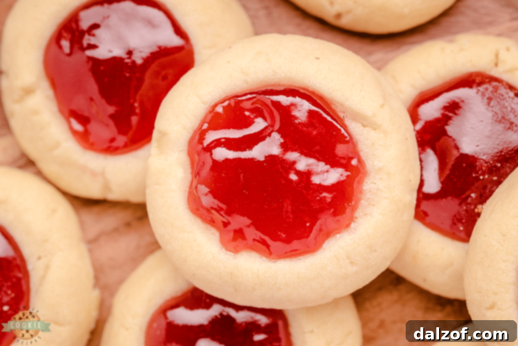 Soft and buttery Strawberry Thumbprint Cookies, filled with sweet strawberry jam.