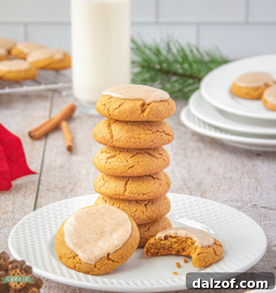 Warmly spiced Iced Ginger Molasses Cookies with a luscious cinnamon icing.