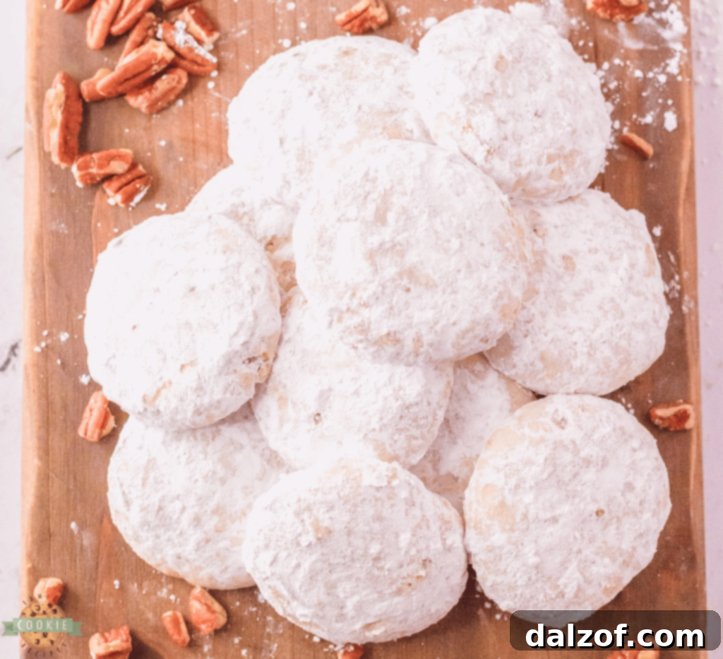 Delicate Danish Wedding Cookies, resembling snowballs, dusted with powdered sugar.