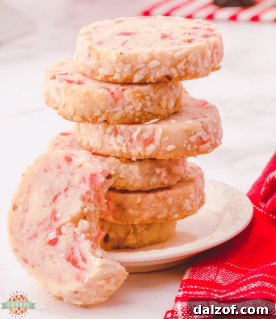 Charming Santa's Whiskers Cookies, featuring cherries, pecans, and a coconut coating.