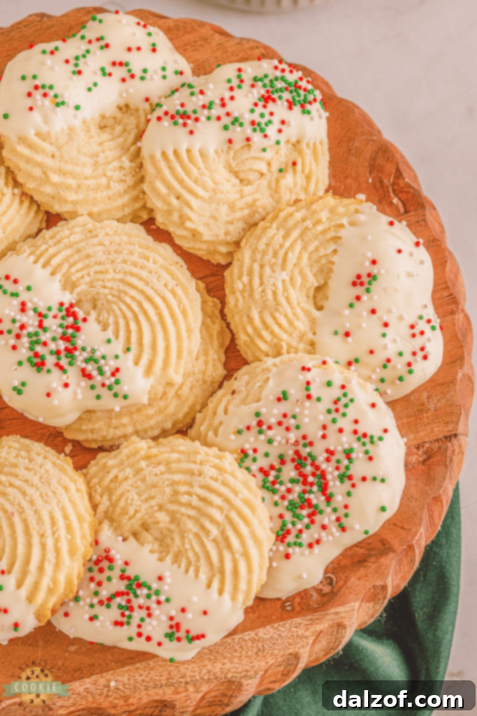 Classic White Chocolate Butter Cookies, covered in white chocolate and festive sprinkles.