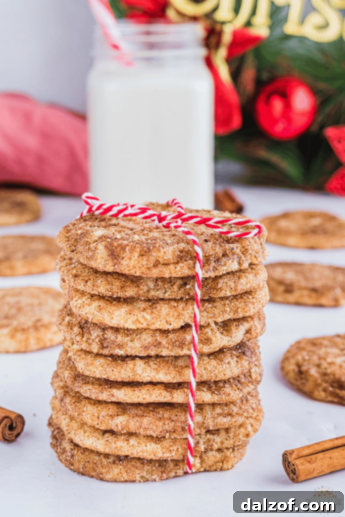 Soft and chewy Holiday Spiced Snickerdoodles, rolled in cinnamon, ginger, and nutmeg sugar.