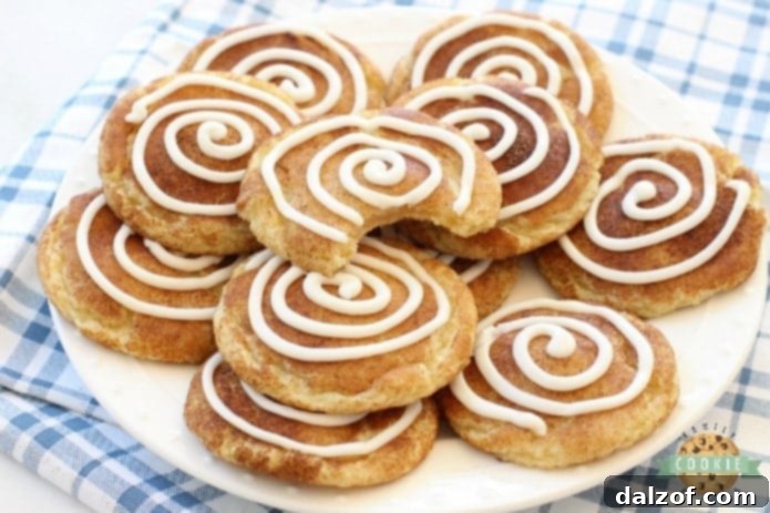 Cinnamon Roll Snickerdoodles are your favorite snickerdoodle cookies with the addition of a sweet vanilla swirl on top! A fun variation on a Snickerdoodle recipe for anyone who loves Cinnamon Rolls!