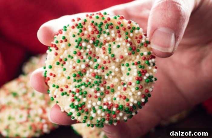 Soft Batch Christmas Sprinkle Cookies, an easy no-roll sugar cookie packed with red and green sprinkles.