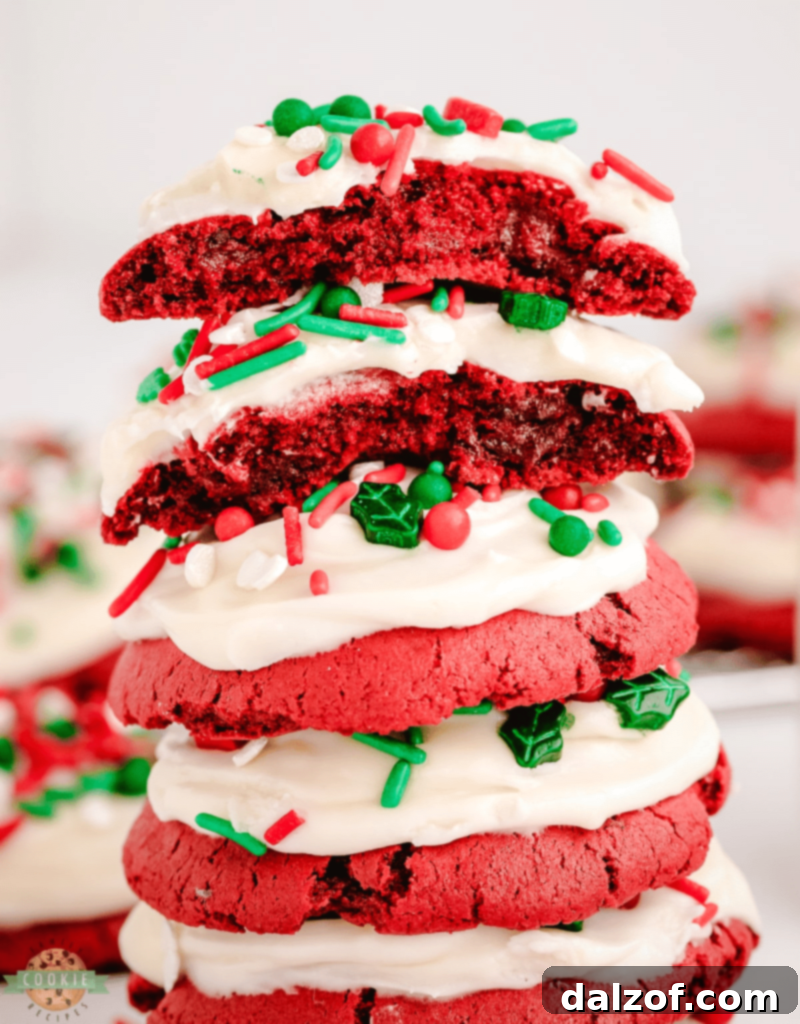 Rich Red Velvet Christmas Cookies with creamy white frosting, featuring the iconic festive red color.