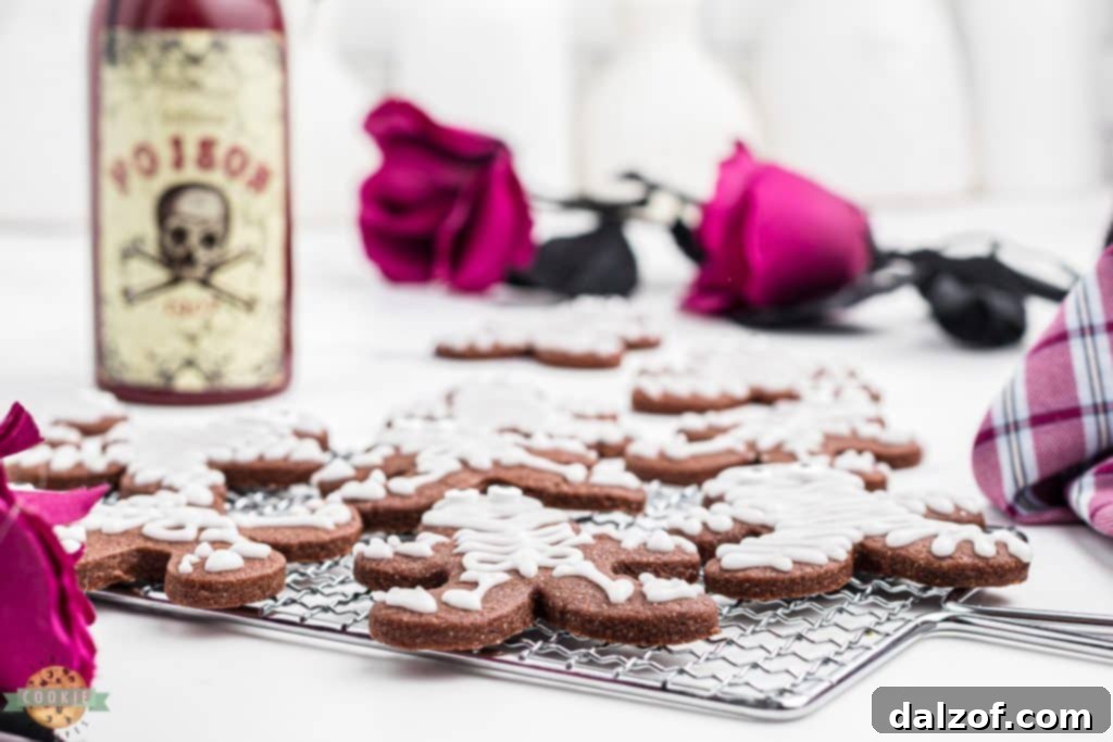 halloween skeleton cookies on a cooling rack