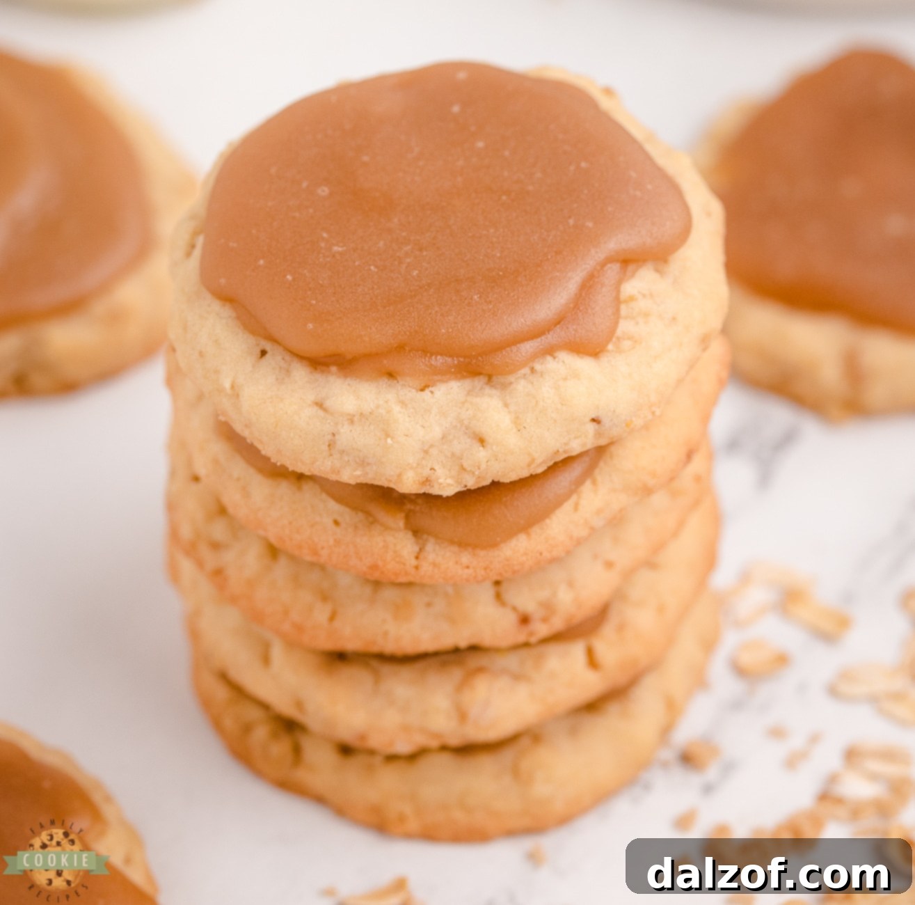 stack of golden brown sugar oatmeal cookies with visible oats