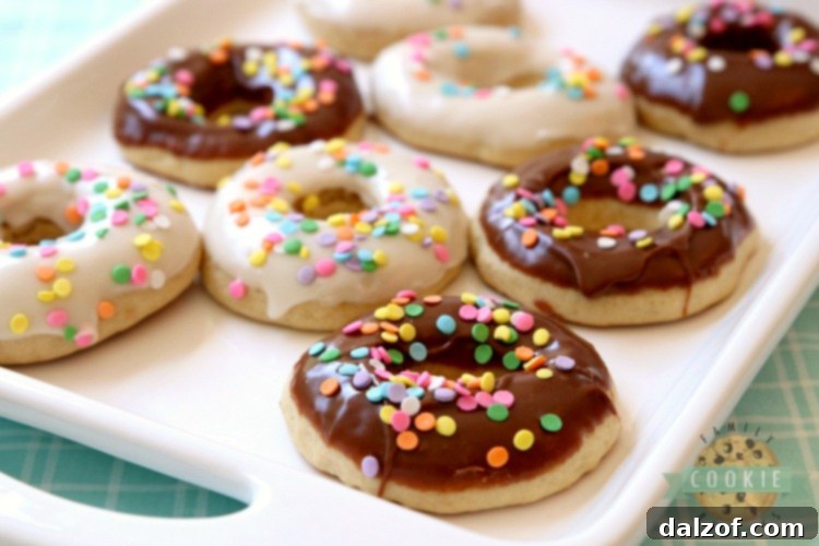 Glazed Donut Cookies are soft & pillowy donut-shaped cookies with a lovely chocolate or vanilla glaze & topped with sprinkles! Everything you love about donuts, only in cookie form!