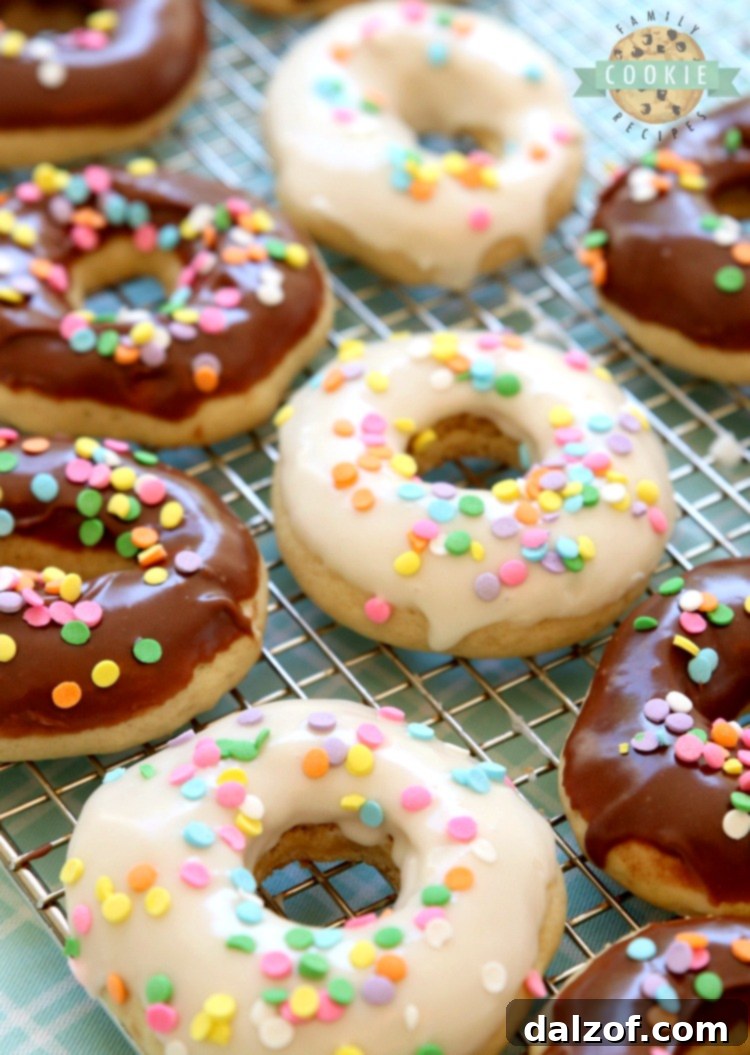 Glazed Donut Cookies are soft & pillowy donut-shaped cookies with a lovely chocolate or vanilla glaze & topped with sprinkles! Everything you love about donuts, only in cookie form!