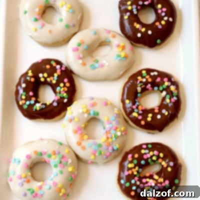 Glazed Donut Cookies are soft & pillowy donut-shaped cookies with a lovely chocolate or vanilla glaze & topped with sprinkles! Everything you love about donuts, only in cookie form!