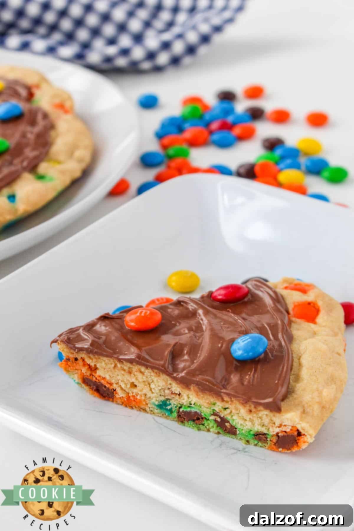 M&M Cookie Pizza is soft, chewy and covered in chocolate. This skillet cookie recipe is easy to make completely from scratch and everyone will love it! 