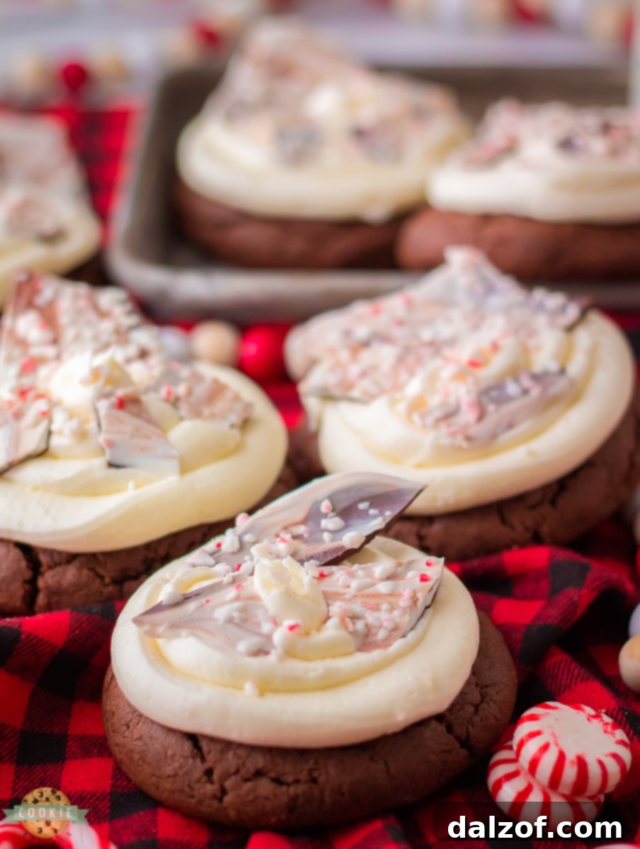 Frosted Peppermint Bark Cookies with crushed candy canes on top.