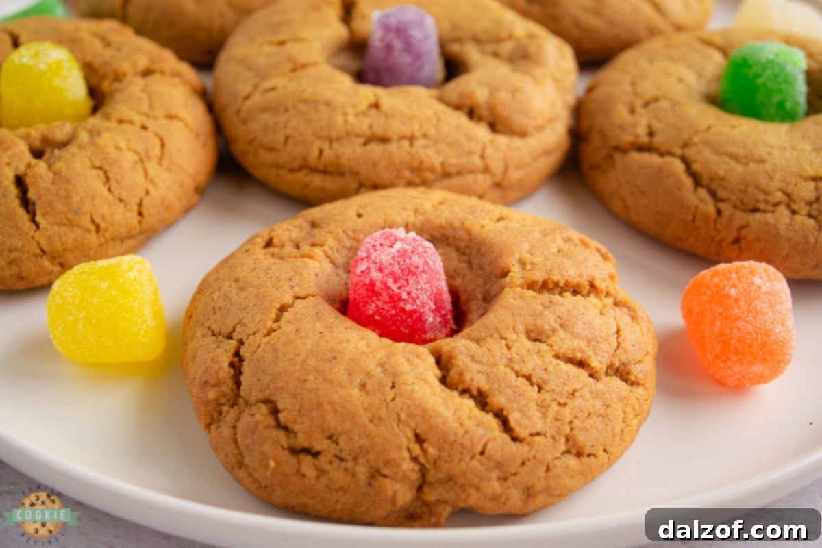 gingerbread drop cookies with a gumdrop in the middle