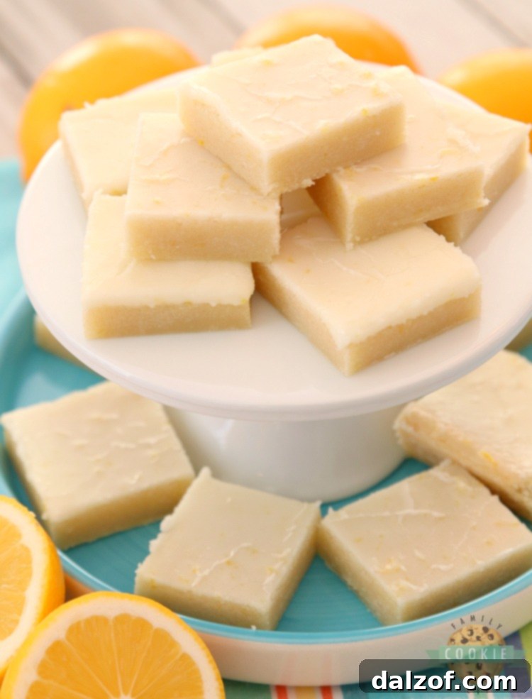 Close-up of Lemon Sugar Cookie Bars, showing the soft base and thick lemon glaze