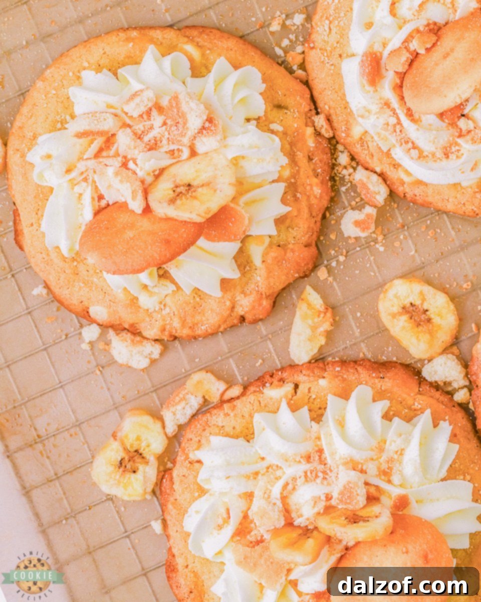 pretty frosted banana cream cookies on a wire rack