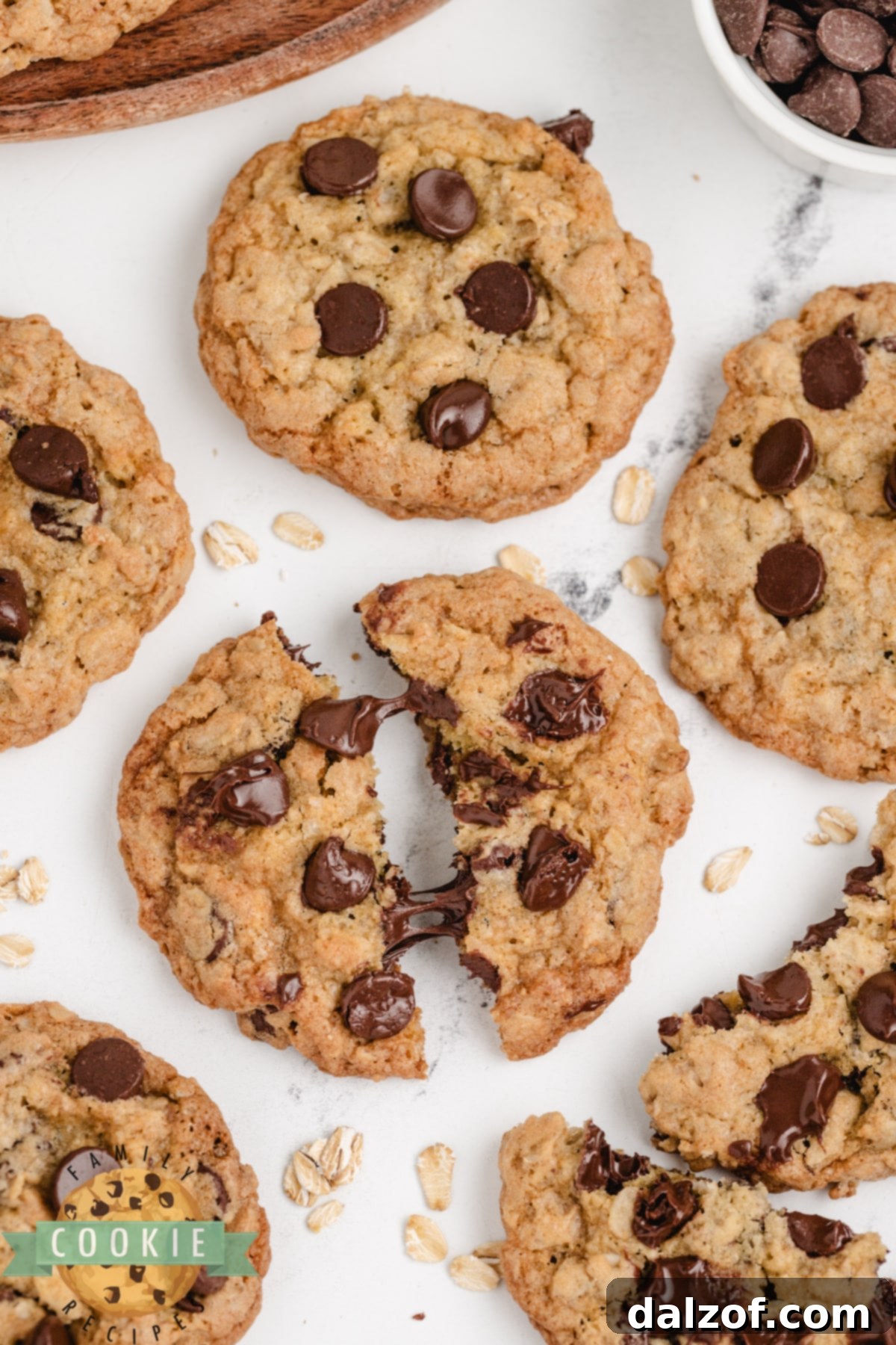 Close-up of freshly baked Oatmeal Chocolate Chip cookies on a cooling rack.
