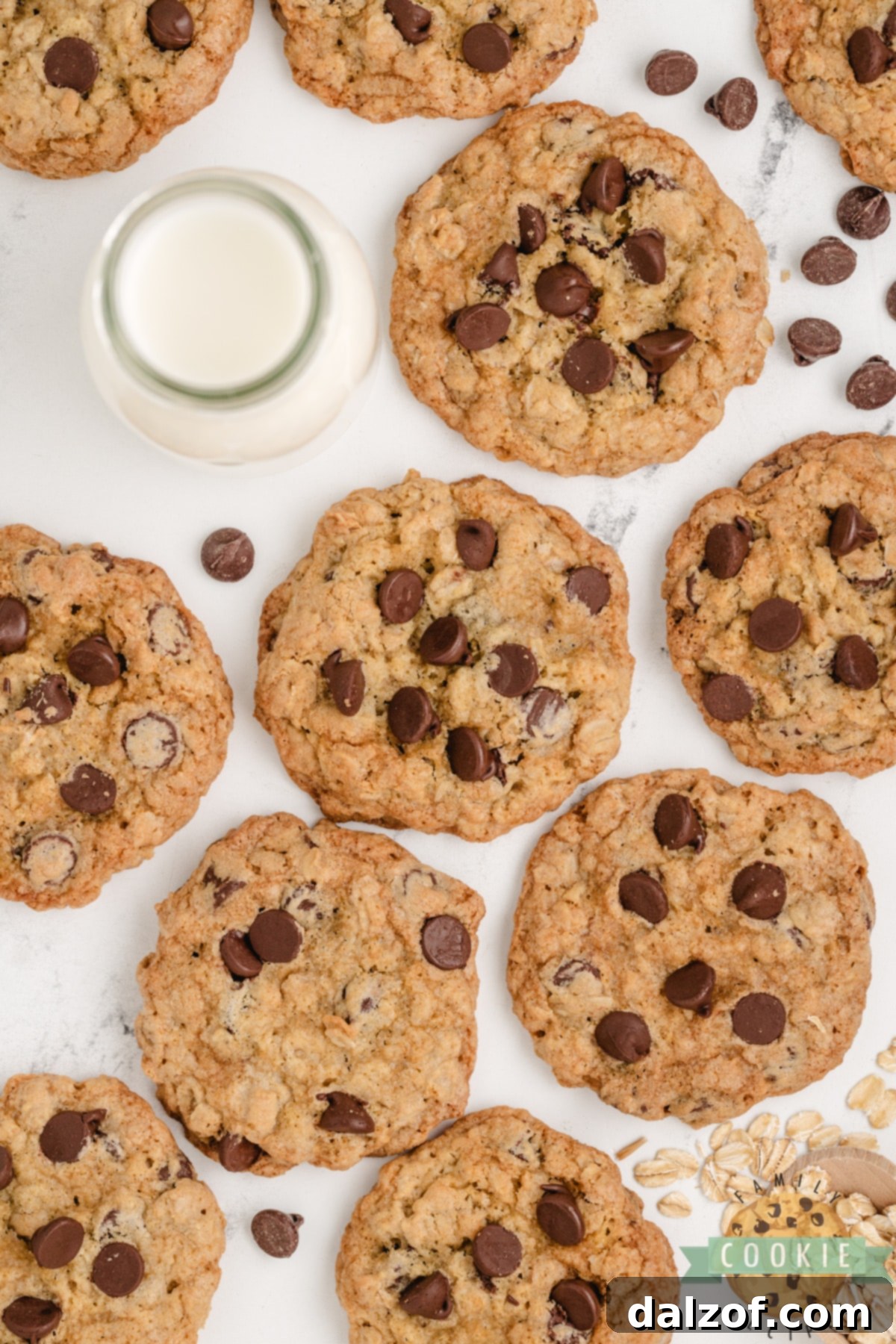 Freshly baked Oatmeal Chocolate Chip Cookies alongside a glass of milk.
