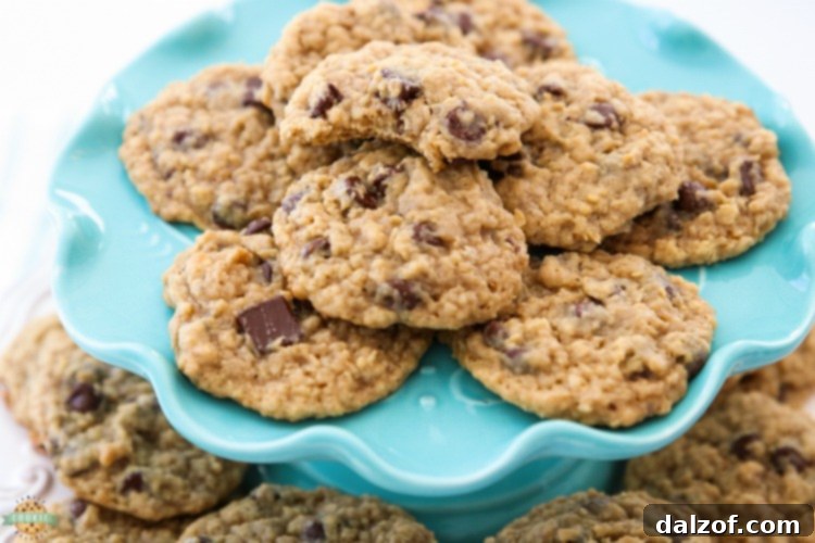 A stack of golden brown Chocolate Chip Oatmeal Cookies, perfectly baked and ready to be enjoyed.