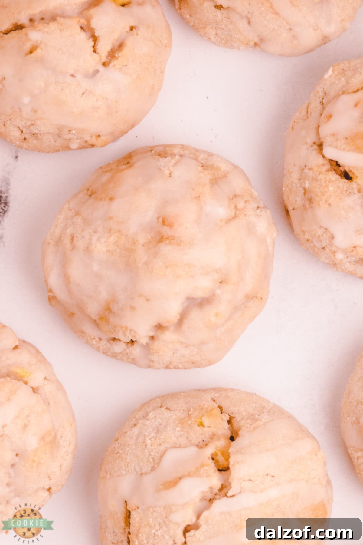 Freshly baked scookies with a basic sweet glaze drizzled on top, arranged on a plate.